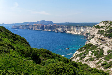 Fototapeta na wymiar Bay and citadel of Banifacio in Corsica coast 