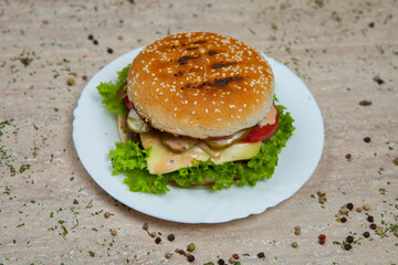 Fresh and juicy hamburger. Delicious cheese burger on a rustic wooden table