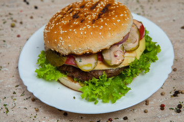 Fresh and juicy hamburger. Delicious cheese burger on a rustic wooden table