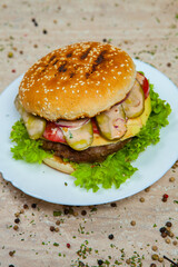 Fresh and juicy hamburger. Delicious cheese burger on a rustic wooden table