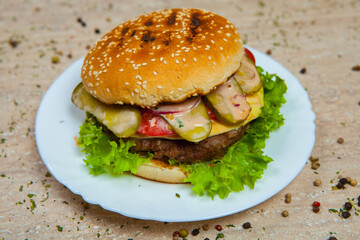 Fresh and juicy hamburger. Delicious cheese burger on a rustic wooden table