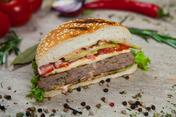 Fresh and juicy hamburger. Delicious cheese burger on a rustic wooden table