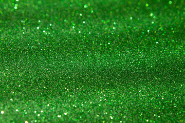 Naklejka premium green shiny glitter background