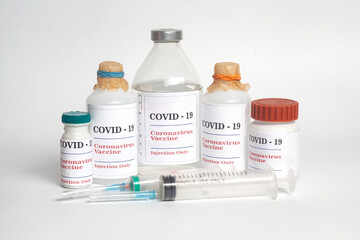 Coronavirus Vaccine injection vials medicine drug bottles Covid-19 with syringe
