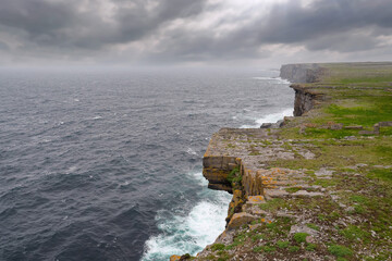 Atlantic ocean and cliff of Inishmore, Aran islands, county Galway, Ireland. Cloudy day, Nobody....