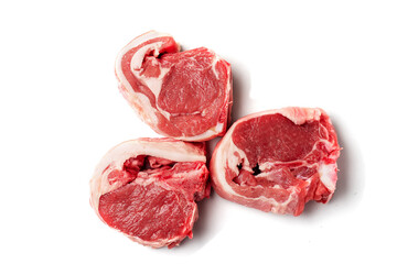 Three raw uncooked lamb loin chops on a white background, isolated, Meat industry product