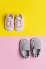 Baby shoes on color background