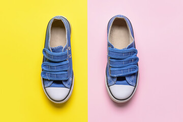 Child's shoes on color background