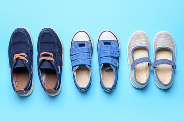 Child's shoes on color background