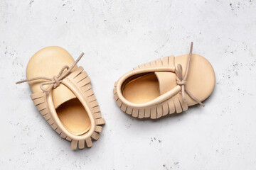 Baby shoes on light background