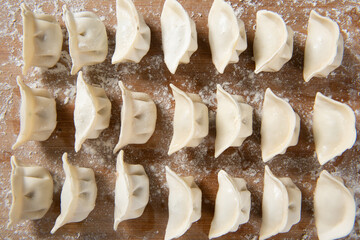 Dumplings background. Cooking dumplings in the kitchen.