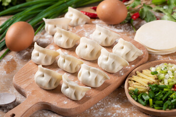 Fototapeta na wymiar Dumplings background. Cooking dumplings in the kitchen.