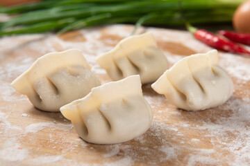 Dumplings background. Cooking dumplings in the kitchen.
