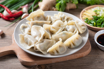Close up fresh boiled dumplings. Chinese food on rustic old vintage wooden background