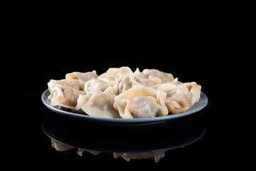 Close up fresh boiled dumplings. Chinese food on rustic old vintage wooden background