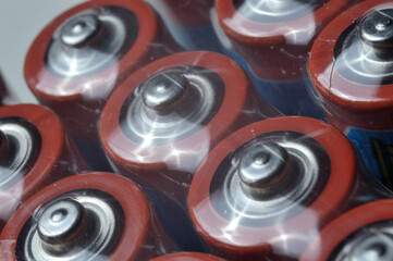 Electric batteries and accumulators of AAA AA standard size. close-up.