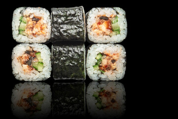 Seafood rolls - isolated black background.