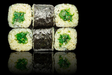 Seafood rolls - isolated black background.