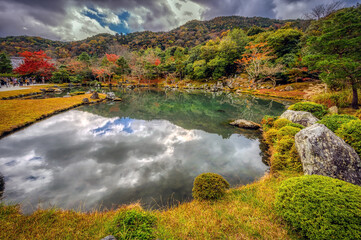 Fototapeta na wymiar Buildings and gardens in autumn at Tenryu-ji Temple, Arashiyama, Kyoto, Japan