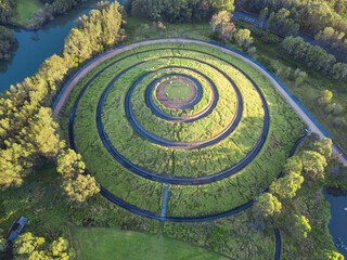 Green spiral hill top under the morning sunlight.