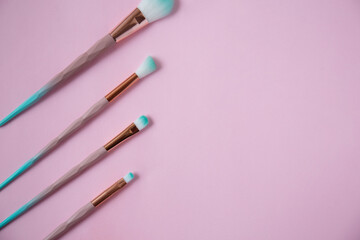 Fototapeta premium Set of make up brushes isolated on pink. Flat lay. 
