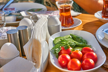 Enjoying a glass of Turkish tea at breakfast