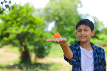Cute indian little child playing Lattu, Bhovra or Bambaram is a traditional throwing top using thread, played mainly in India