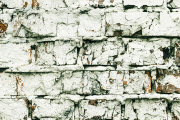 Empty old brick walls texture close-up. Painted problem wall surfaces. Grunge Red Stone Background. Worn facade of the building with damaged plaster. Abstract web banner.