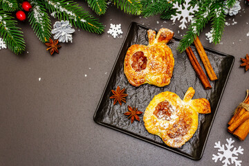 Christmas or New Year sweet apple puffs with festive decor