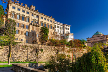 Fototapeta na wymiar Beautiful Porta San Giacomo gate and the city walls of Citta Alta old town in Bergamo, Italy