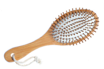 wooden hairbrush isolated on white background with copy space for your text