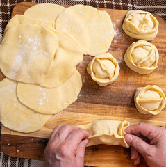  Woman making  manti  with minced beef meat