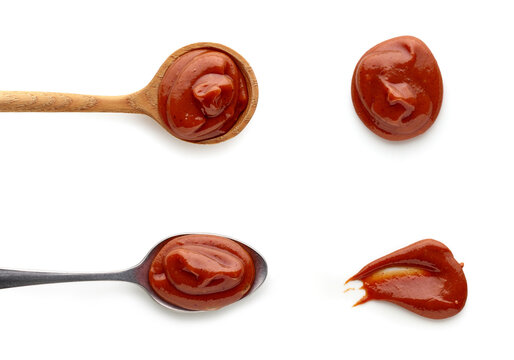 Set Of Tomato Barbeque Sauce In Spoons Top View Isolated On White Background