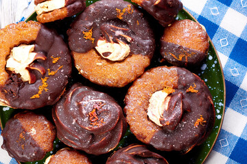 Close up of many delicious marshmallows on a plate on a blue and white napkin. Top view