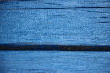 blue oil paint texture with spots and streaks on wooden surface