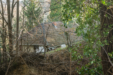 Novi Sad, Serbia - December 06. 2020: Old dilapidated weekend house tucked among the treetops
