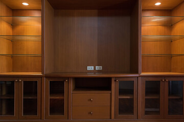 Empty wooden TV storage combination with shelves and drawers