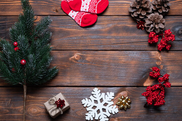 Christmas card composition. Gifts, fir tree branches, red decorations. Christmas, winter, new year concept. Flat lay, top view, copy space.