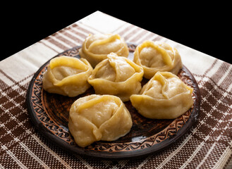 Ready homemade hot manti on the plate