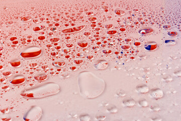 Water drops texture background. Water drops. Red and blue.Selective focus.