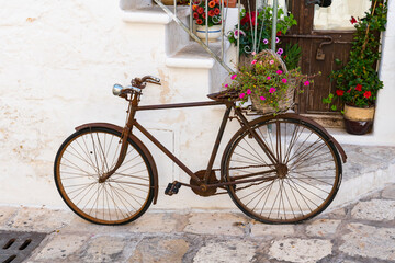 rusty bike with wicker flower basket