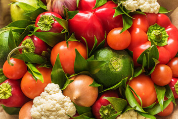 Obraz na płótnie Canvas Vegetable bouquet of cauliflower, radish, onion, tomato, garlic and pepper