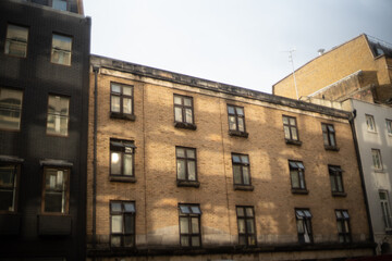 old building in the city, lights and reflections on the building
