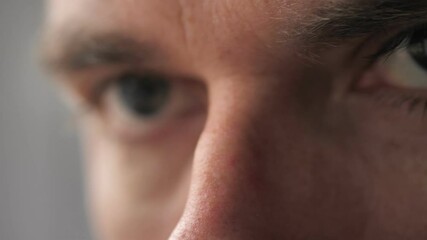 Surprised man with binoculars. Curious guy with big eyes.  Silly funny face. Stalker peeping people. 
Nosy neighbour stalking or snooping secrets, gossip and rumour. Shocked about unbelievable news. 