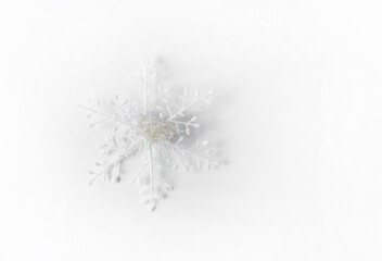 White artificial snowflake. Christmas or New Year decor.