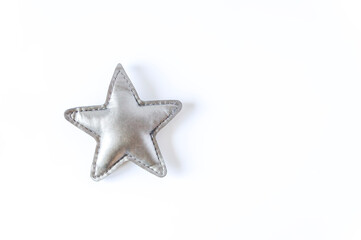 Grey toy star on white background. Decor element