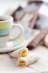 chocolate sticks in a bowl on a white background.