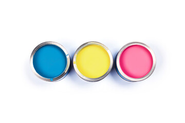 Renovation picture. Isolated white background with three pink, yellow and blue pain cans, central composition. Flat lay, top view, copy space.