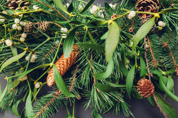 Christmas and New Year design made of fir, pine, mistletoe branches, cones. Eco natural home decor