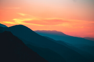 Fototapeta na wymiar Sun setts over Caucasus Mountains. Joyful motivational bright colorful image. Georgia